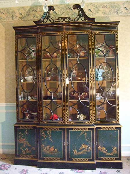 Large antique amoire with glass front for displaying dishes and such.