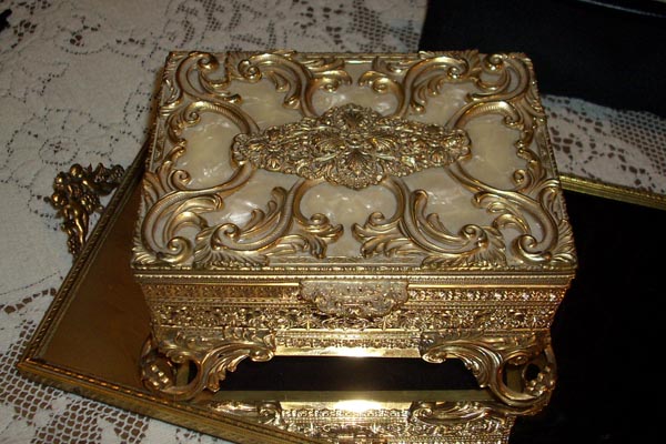 Gold scrollwork inlay on an antique gold box